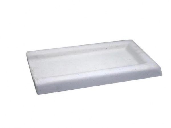 A white tray sitting on top of a table.