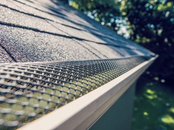 A close up of the gutter on top of a roof
